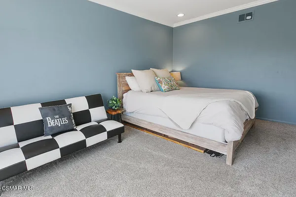 a bathroom with a granite countertop sink a toilet and shower
