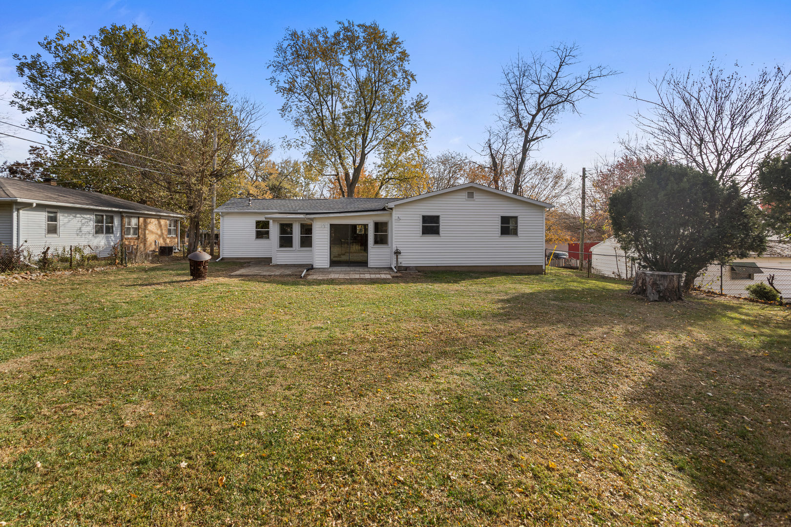 605 South Fair Street Champaign, IL 61821 - Photo 5 of 11 a front view of a house with a yard covered with trees
