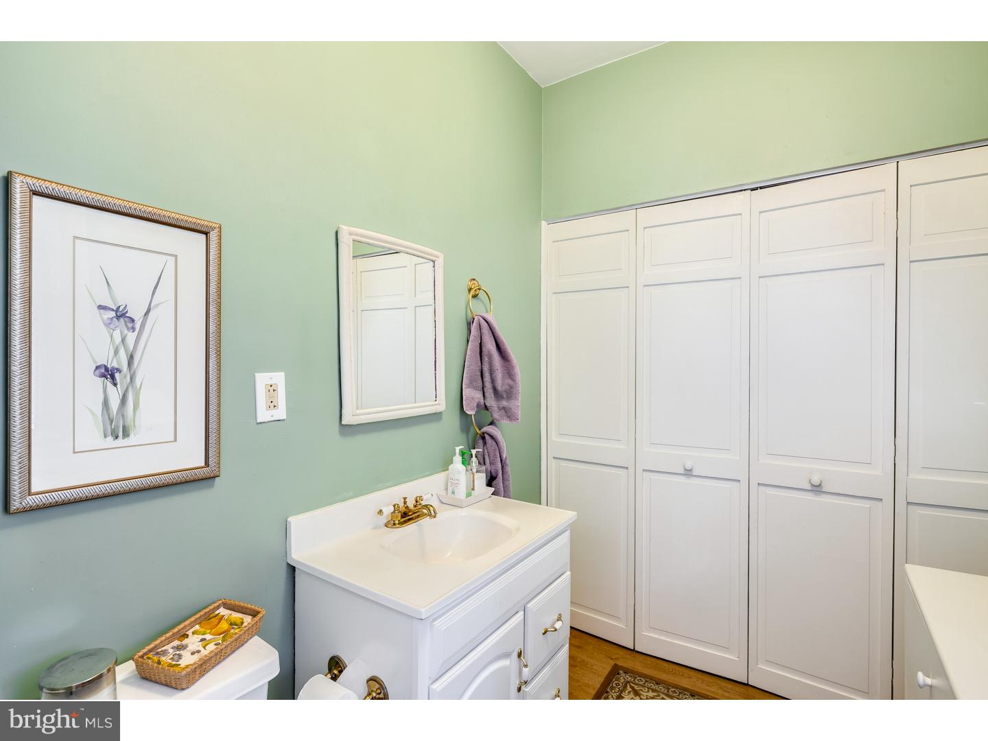 127 Lafayette Avenue Haddonfield, NJ 08033 - Photo 14 of 25 a bathroom with a sink and a mirror