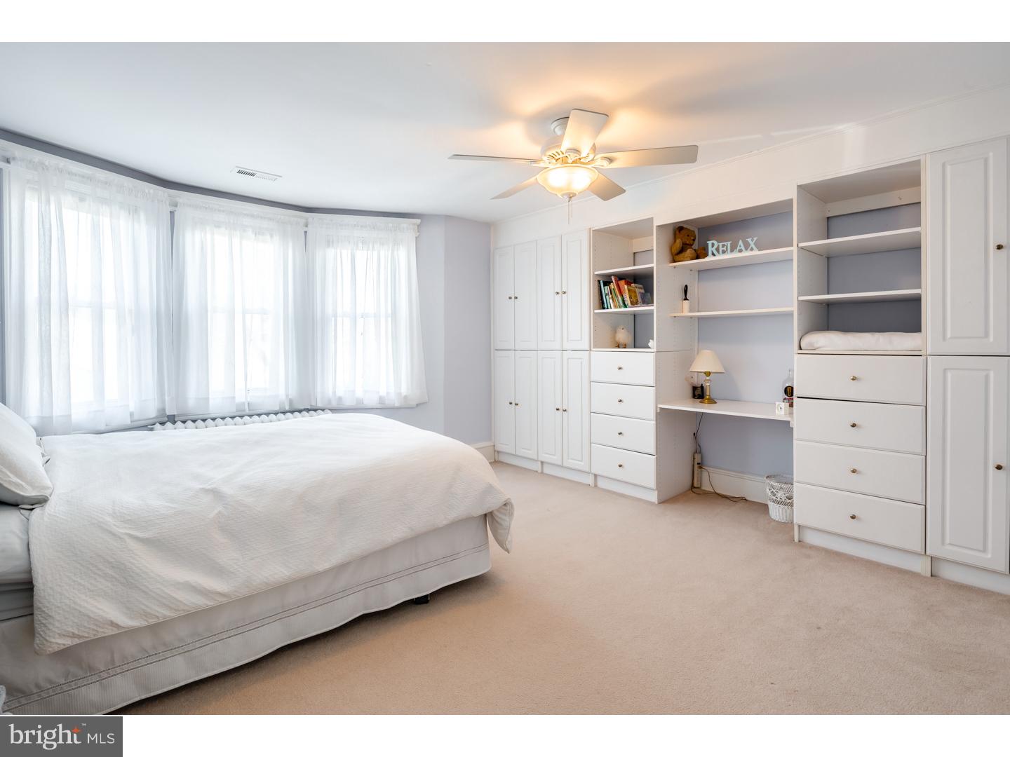 127 Lafayette Avenue Haddonfield, NJ 08033 - Photo 16 of 25 a spacious bedroom with a bed and a cabinets