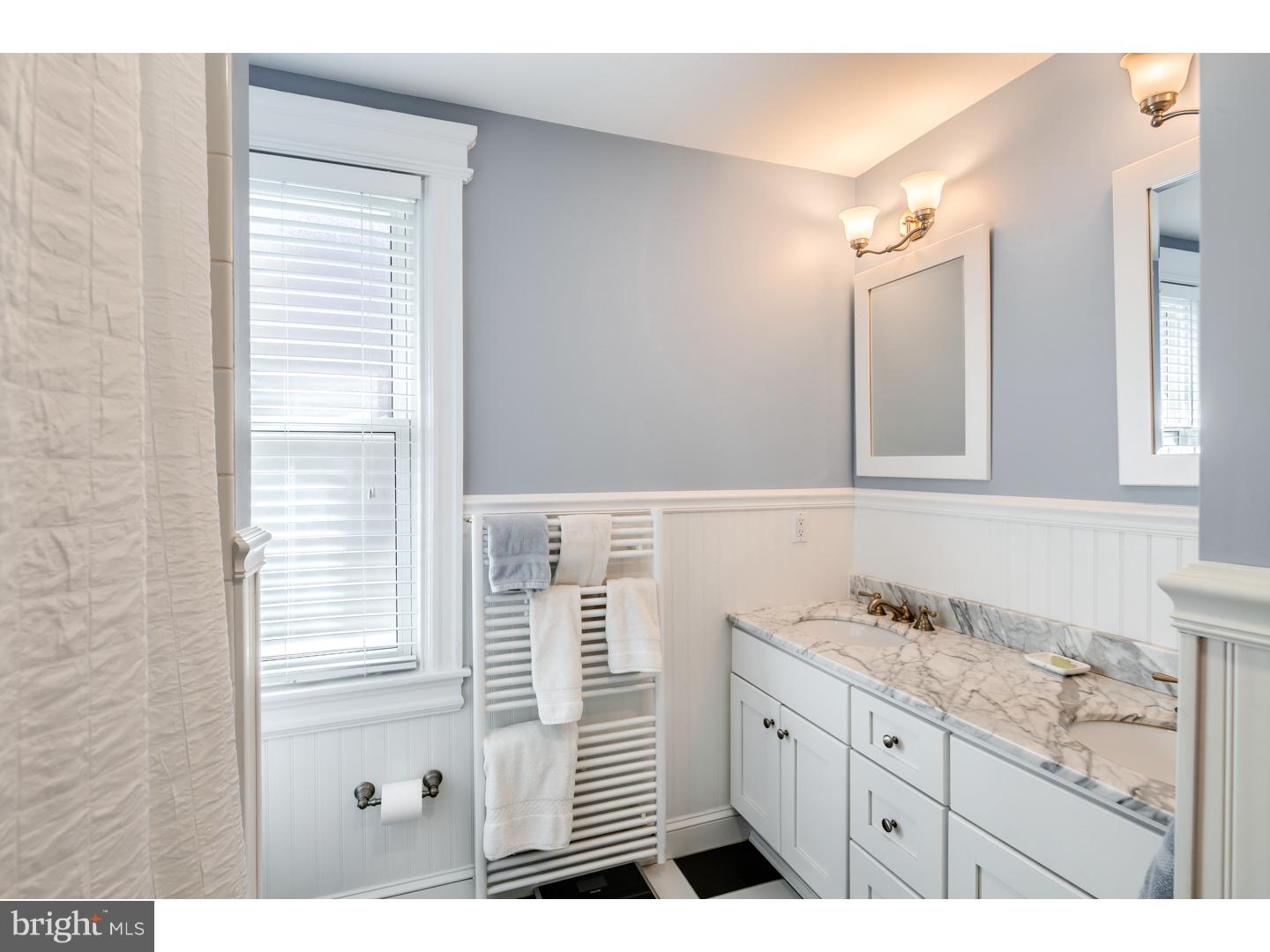127 Lafayette Avenue Haddonfield, NJ 08033 - Photo 17 of 25 a bathroom with a sink a vanity and a mirror