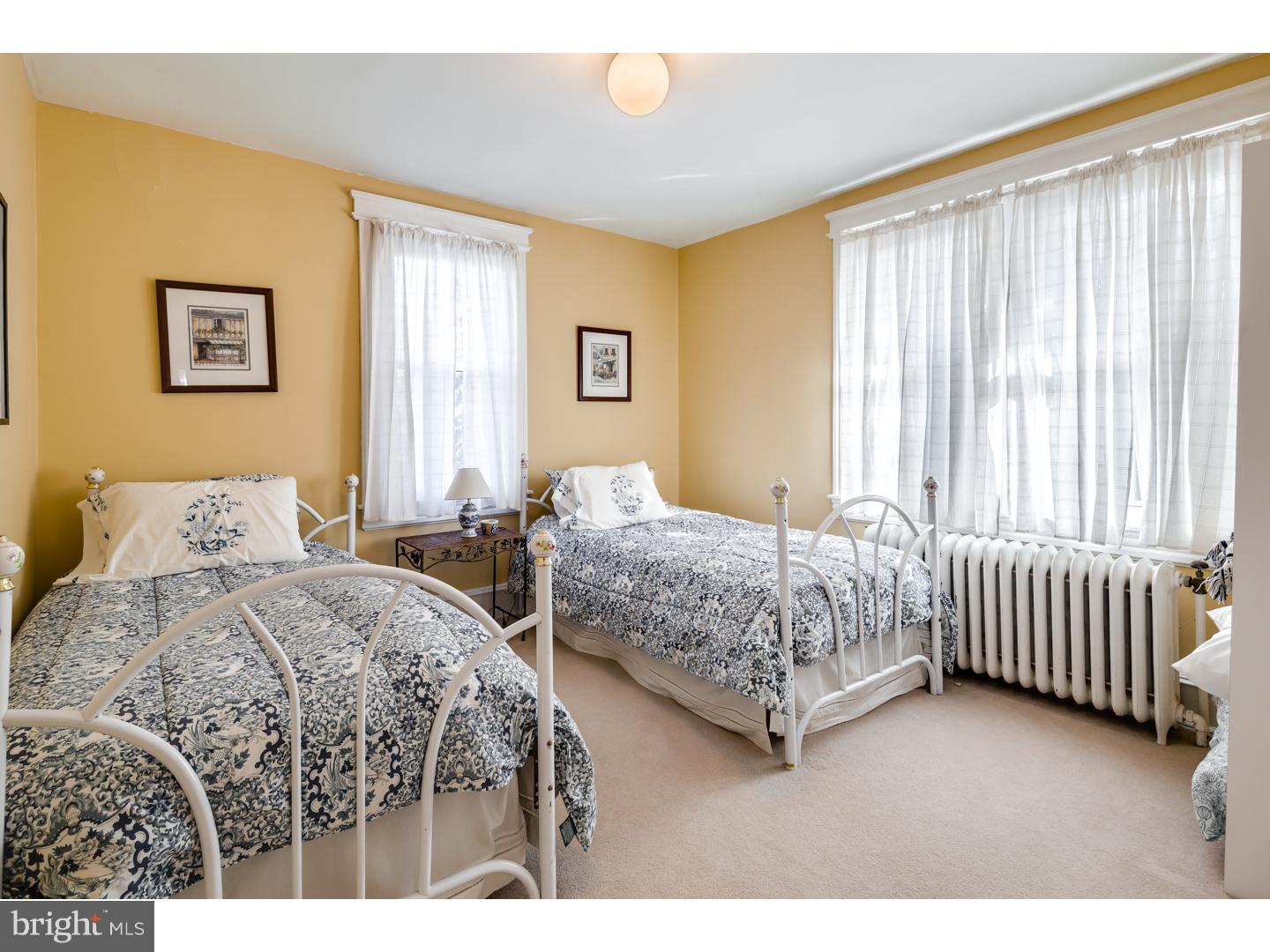 127 Lafayette Avenue Haddonfield, NJ 08033 - Photo 18 of 25 a bedroom with two beds and a window