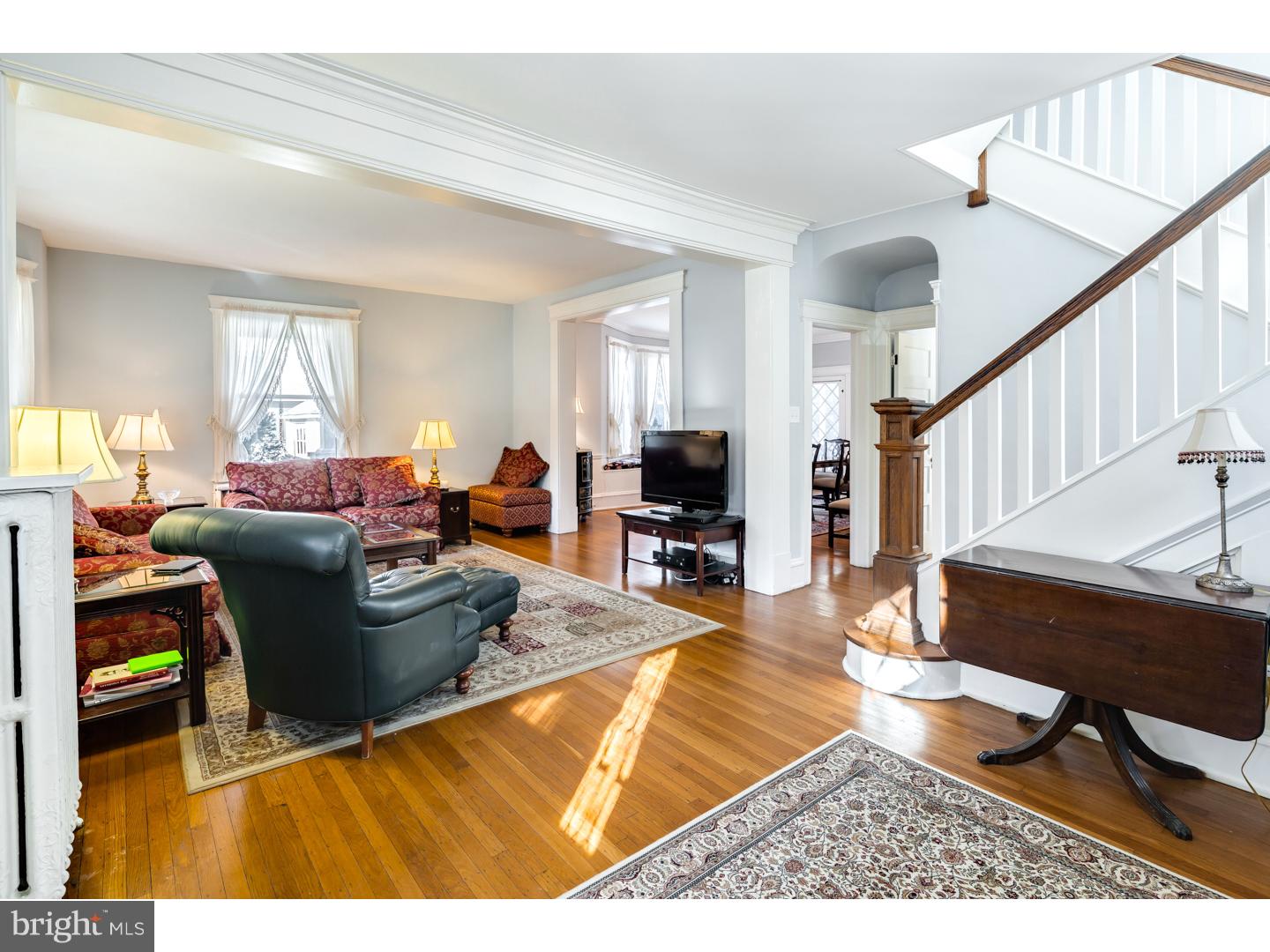 127 Lafayette Avenue Haddonfield, NJ 08033 - Photo 3 of 25 a living room with furniture a rug and a chandelier