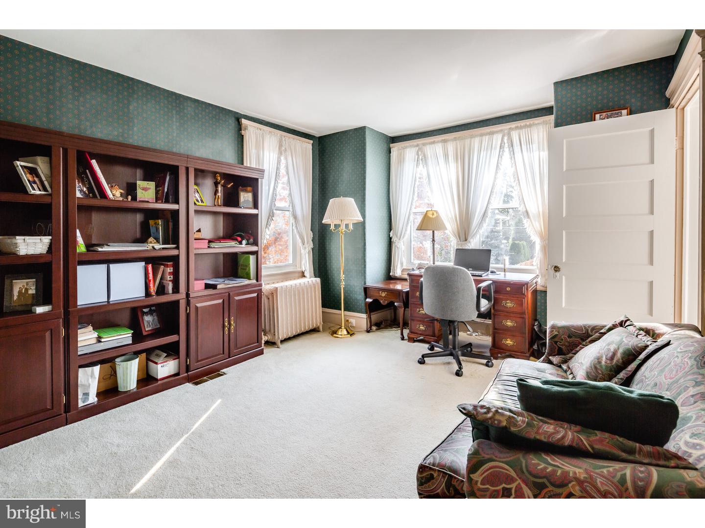 127 Lafayette Avenue Haddonfield, NJ 08033 - Photo 23 of 25 a living room with furniture and a book shelf