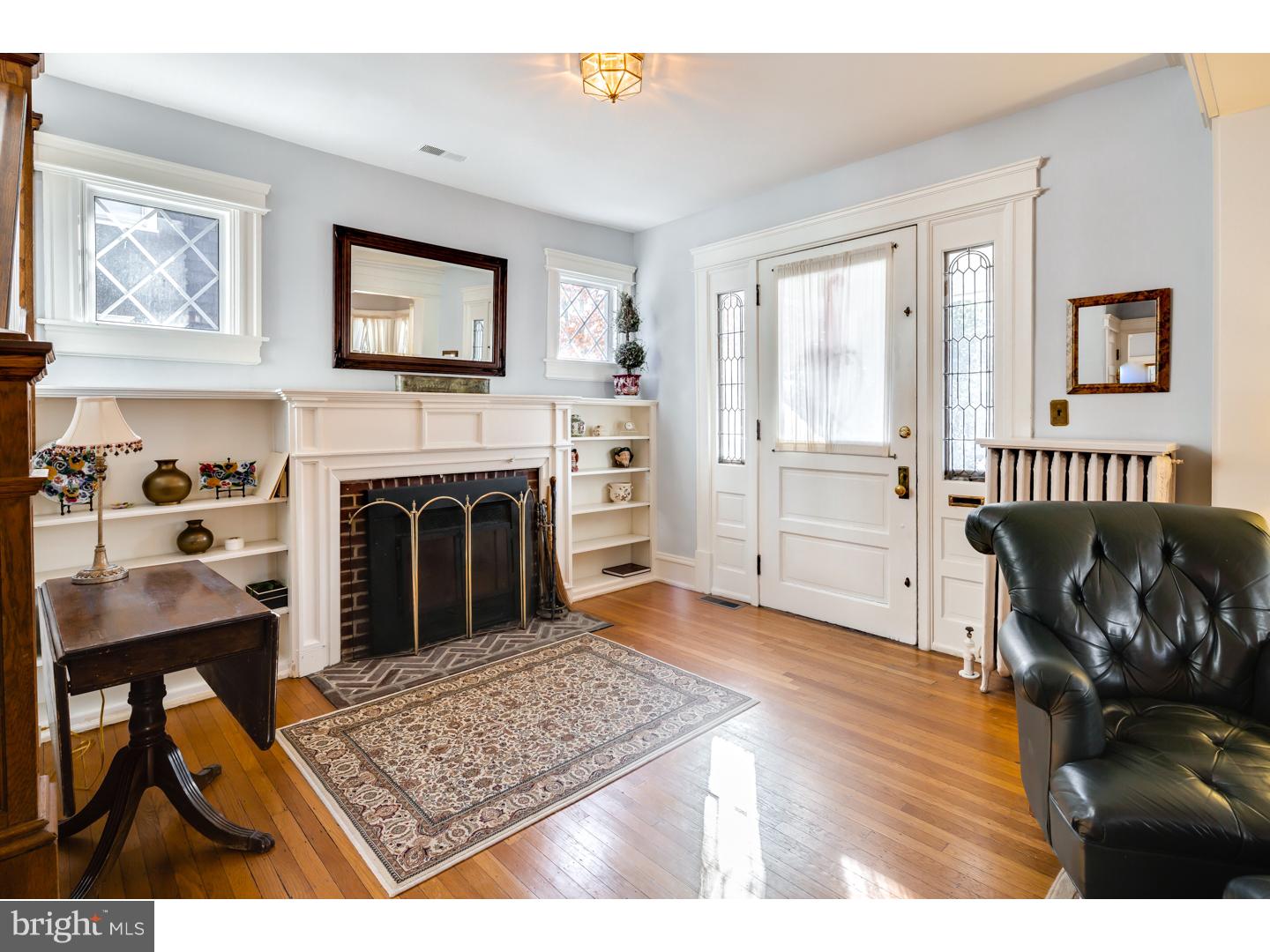 127 Lafayette Avenue Haddonfield, NJ 08033 - Photo 4 of 25 a living room with furniture and a fireplace