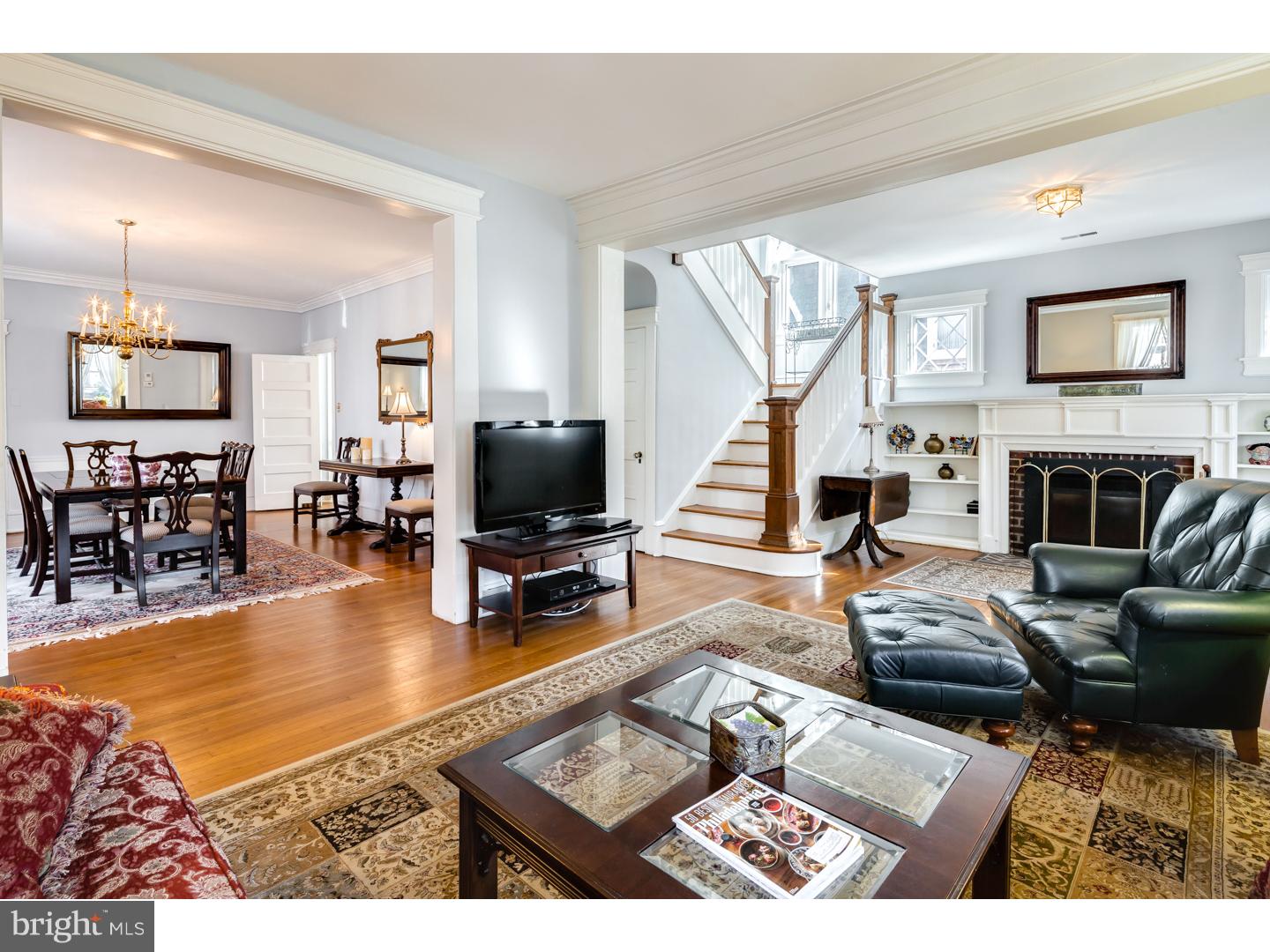 127 Lafayette Avenue Haddonfield, NJ 08033 - Photo 5 of 25 a living room with furniture flat screen tv and a fireplace