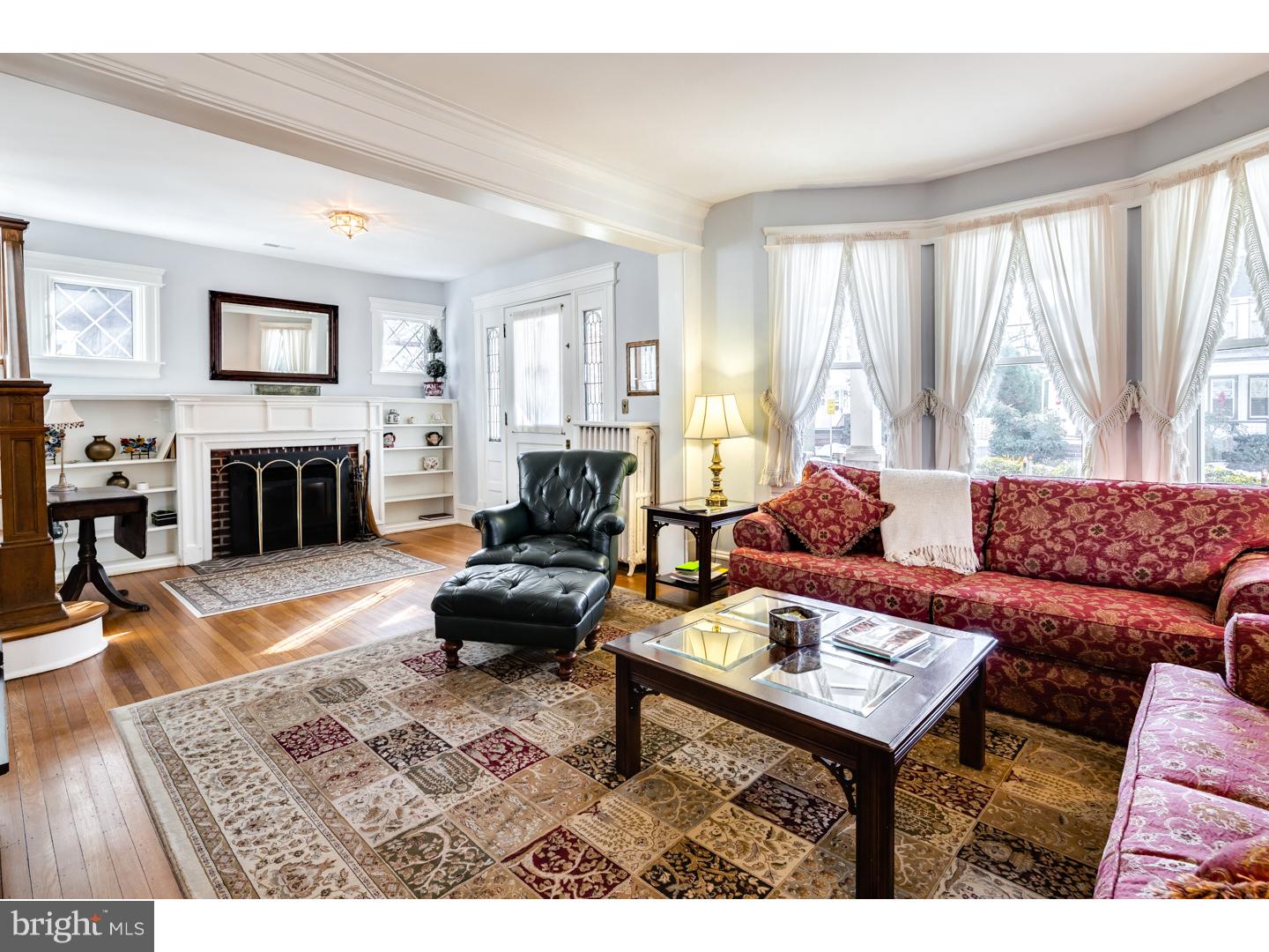 127 Lafayette Avenue Haddonfield, NJ 08033 - Photo 6 of 25 a living room with furniture and a fireplace