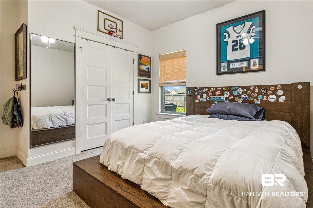 7088 Rocky Rd Loop Gulf Shores, AL 36542 - Photo 24 of 39 Bedroom featuring carpet flooring and a closet