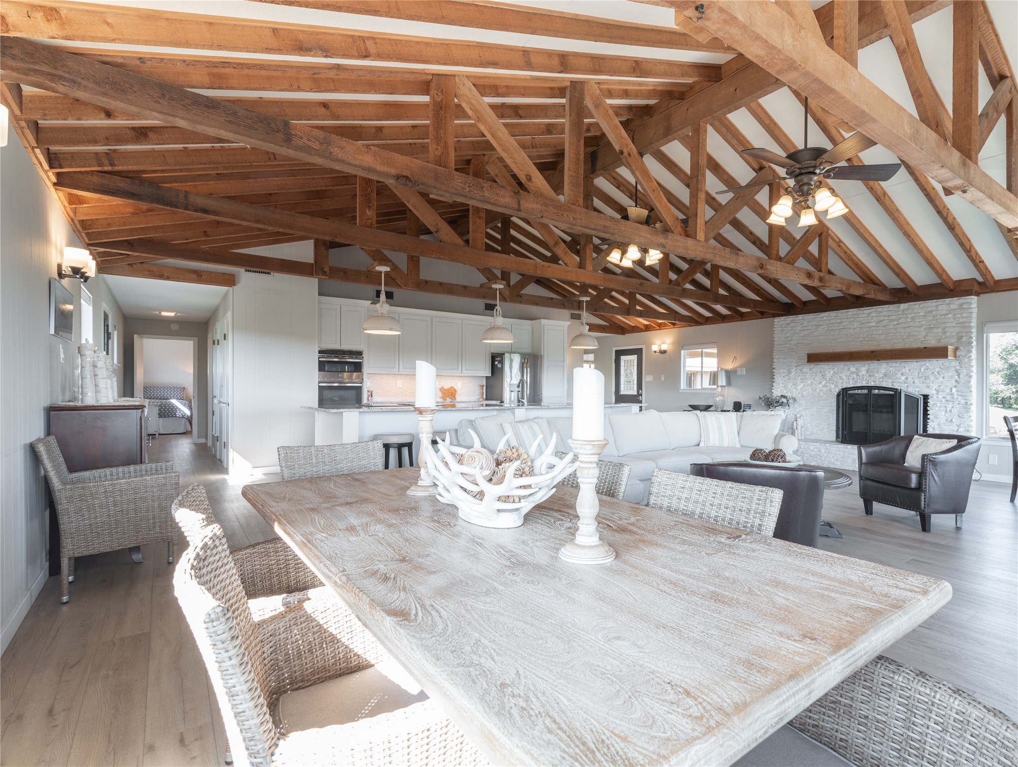 3807 Boat Dock Road Lago Vista, TX 78645 - Photo 10 of 37 Exposed beams and vaulted ceilings create an airy atmosphere throughout this inviting open-concept living space.