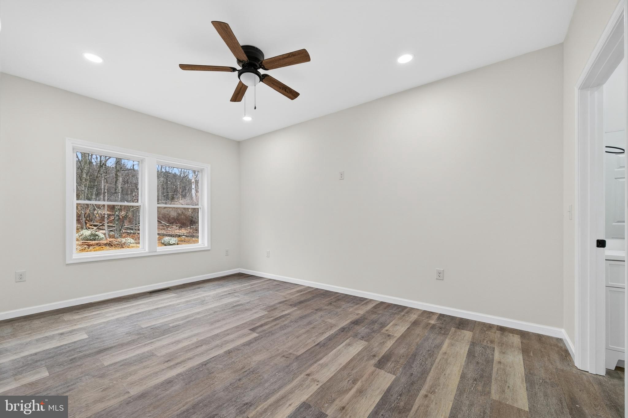 875 Buffalo Rdg Road Augusta, WV 26704 - Photo 13 of 27 wooden floor in an empty room with a window