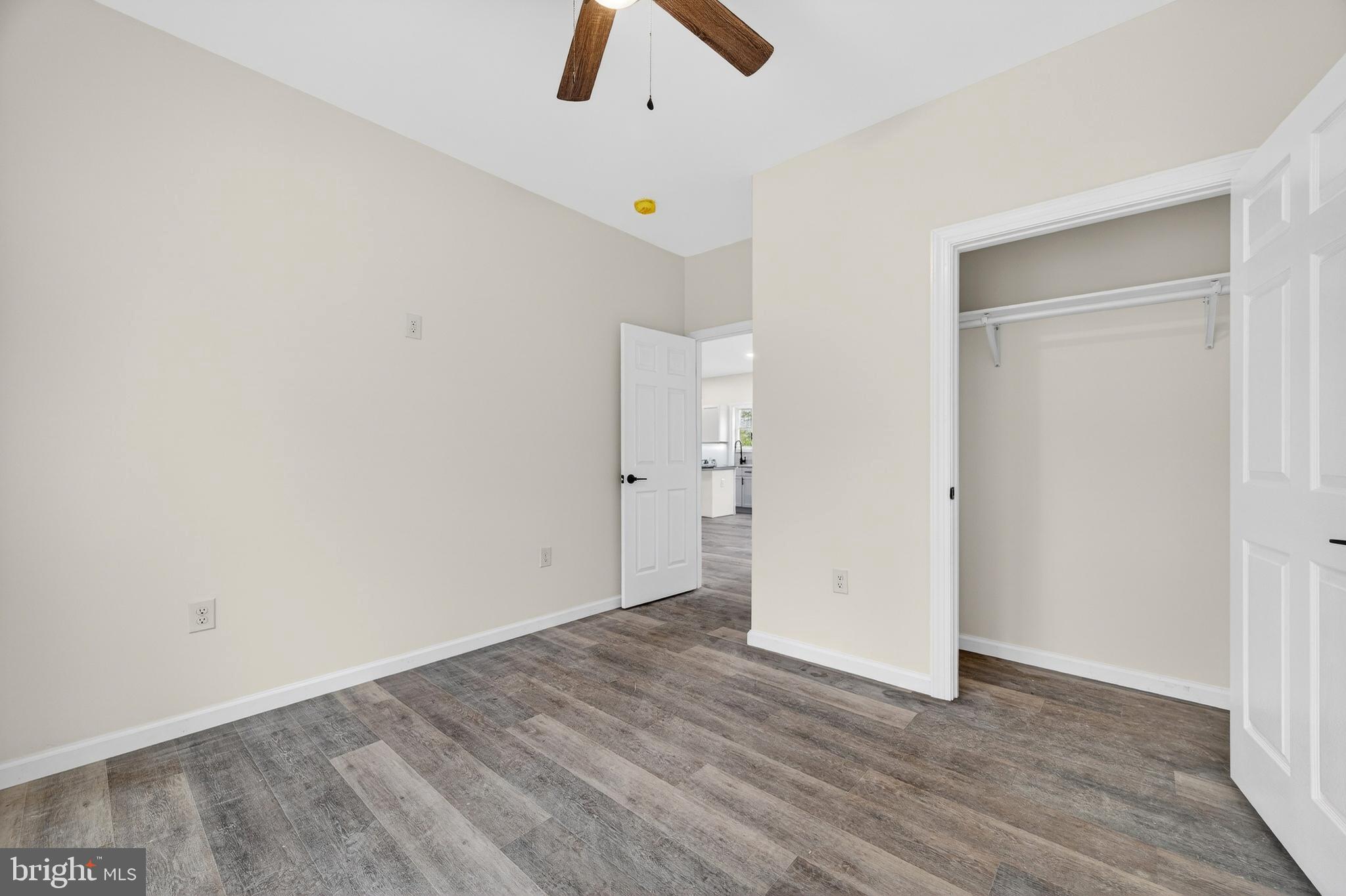 875 Buffalo Rdg Road Augusta, WV 26704 - Photo 21 of 27 an empty room with ceiling fan and window