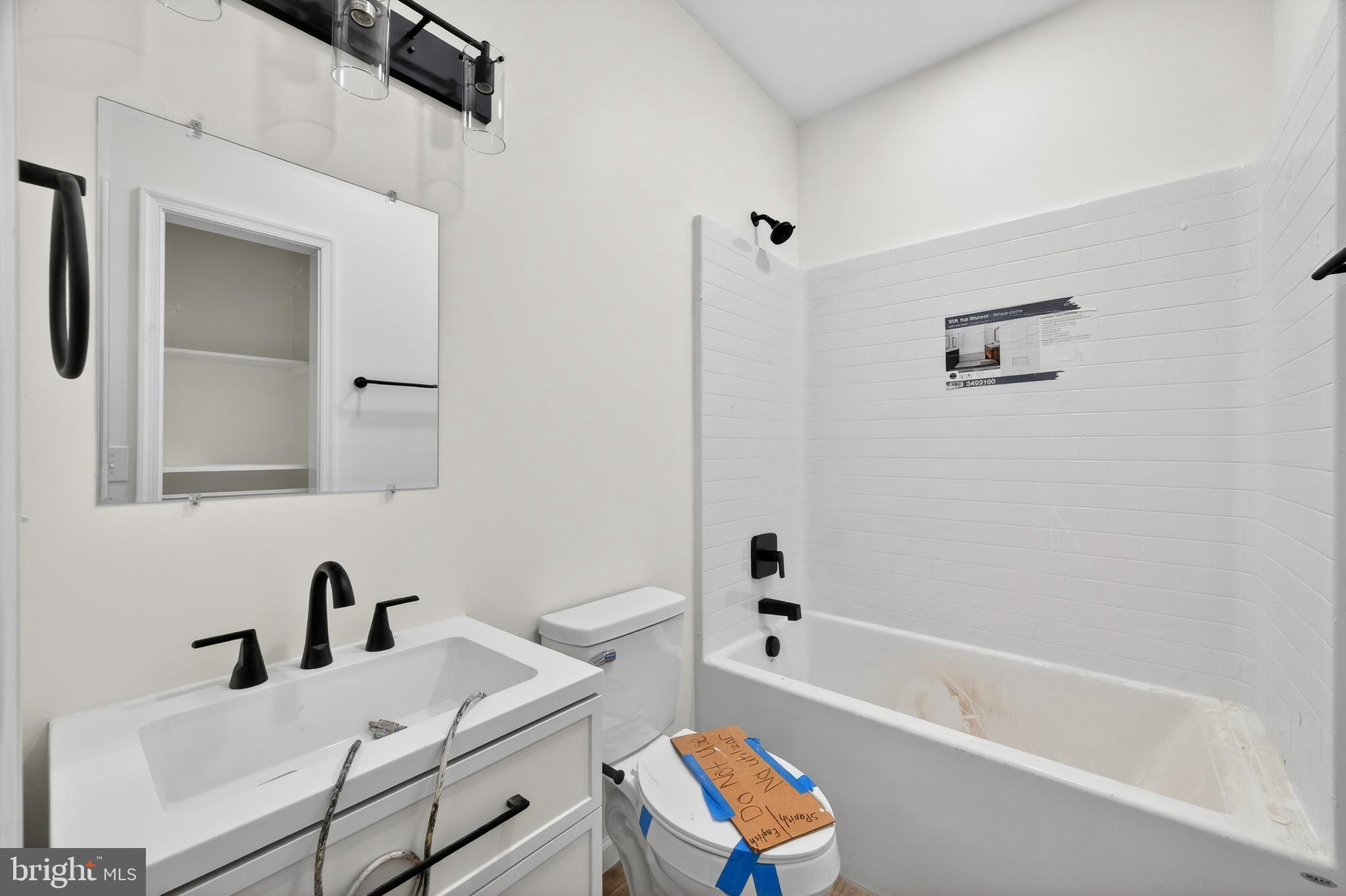 875 Buffalo Rdg Road Augusta, WV 26704 - Photo 23 of 27 a bathroom with a bathtub sink vanity and toilet