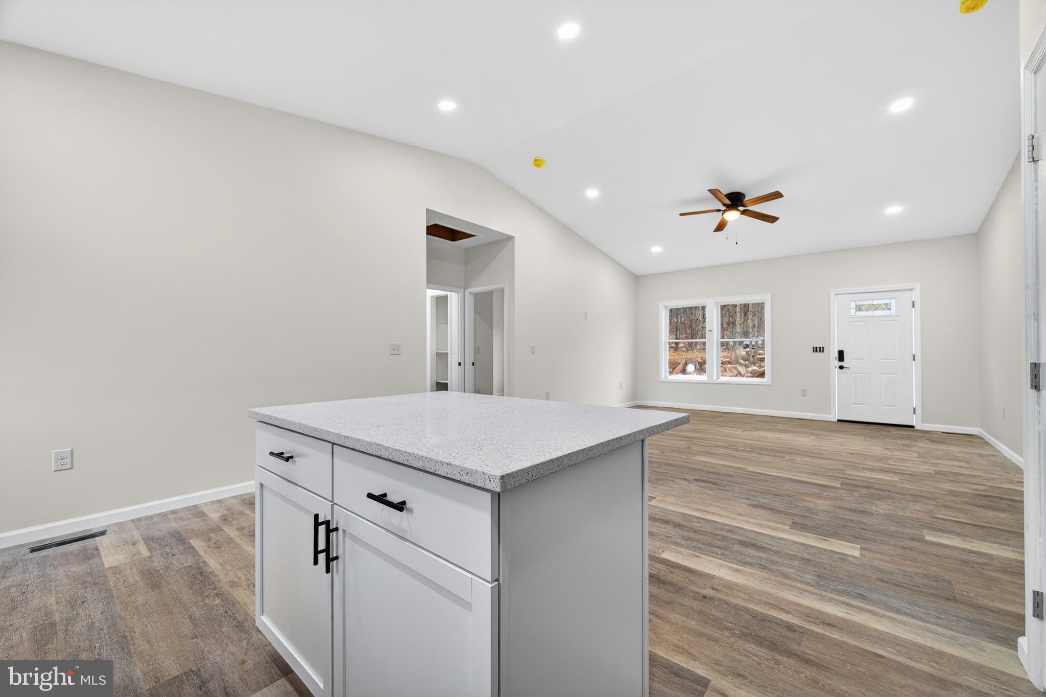 875 Buffalo Rdg Road Augusta, WV 26704 - Photo 10 of 27 a hall with kitchen island a stove and a refrigerator