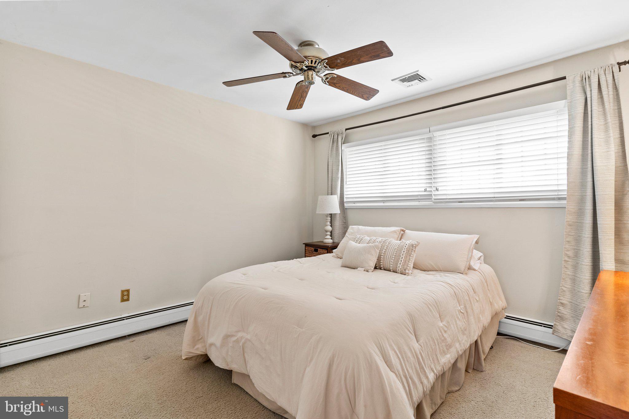 11 Trellis Road Levittown, PA 19056 - Photo 17 of 37 a bedroom with a bed and window