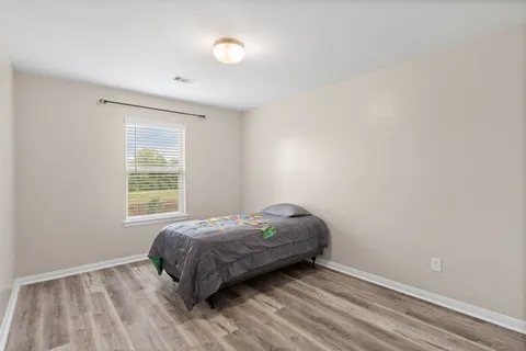 a room with a bed and a window