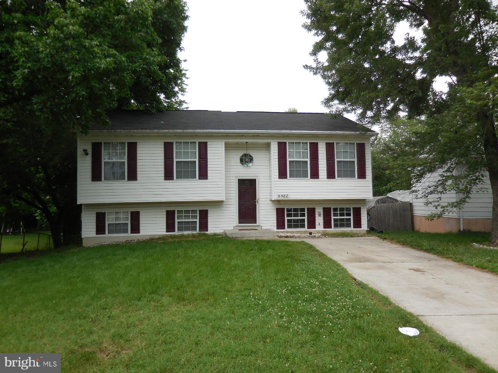 6322 Springbrook Lane Clinton, MD 20735 - Photo 1 of 9 a view of a yard in front of a house