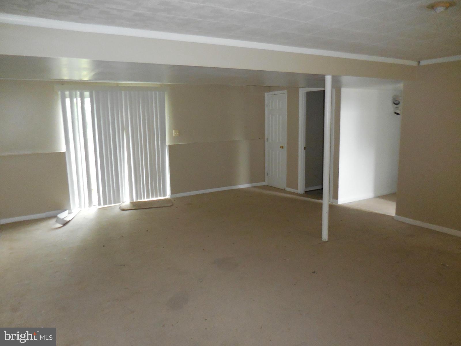 6322 Springbrook Lane Clinton, MD 20735 - Photo 8 of 9 an empty room with windows