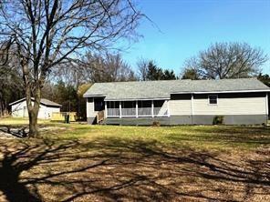 426 Gun Club Road Denison, TX 75021 - Photo 2 of 20 a front view of a house with a yard