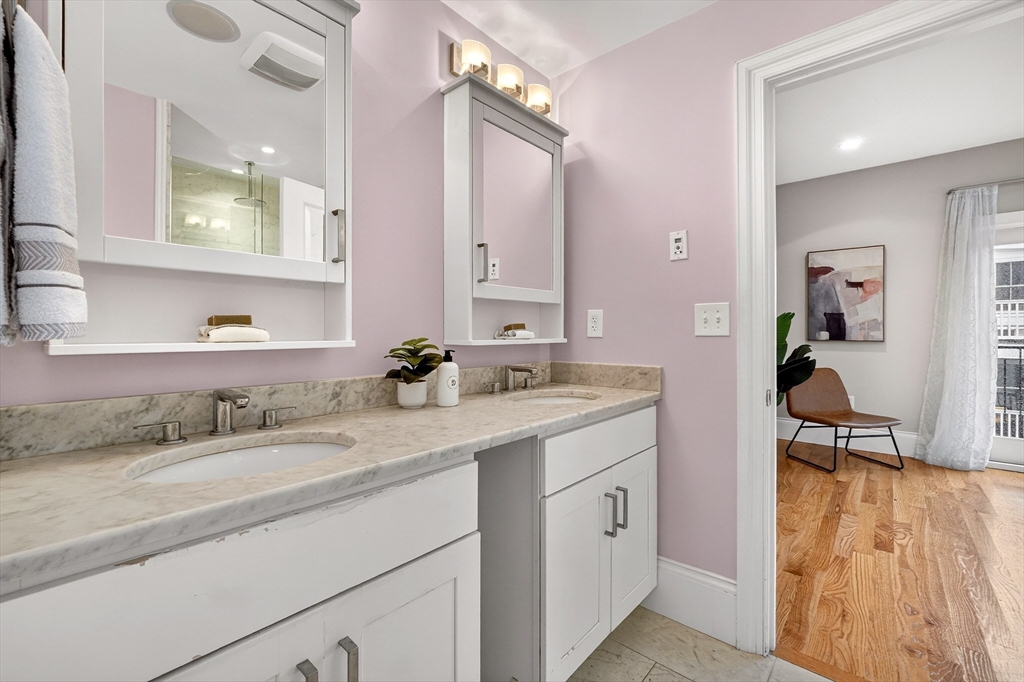 13 Howell Street, Unit 3 Boston, MA 02125 - Photo 20 of 31 a en suite bathroom with a sink and a mirror