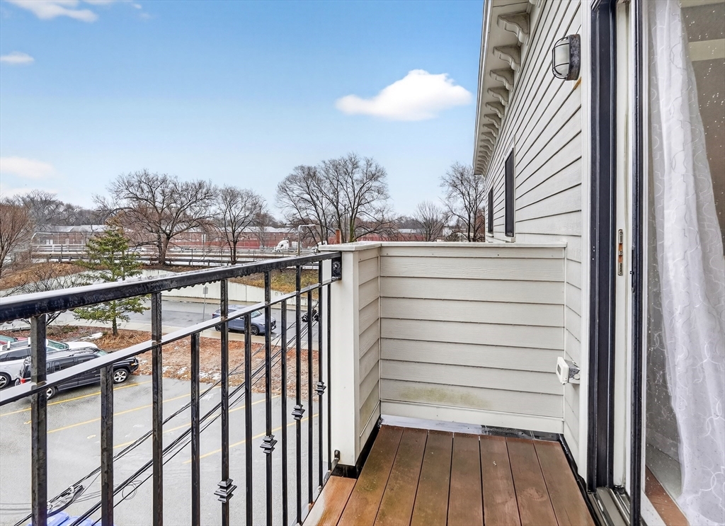 13 Howell Street, Unit 3 Boston, MA 02125 - Photo 22 of 31 a view of a balcony with wooden floor