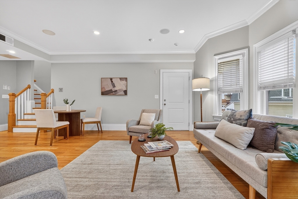 13 Howell Street, Unit 3 Boston, MA 02125 - Photo 3 of 31 a living room with furniture and a rug