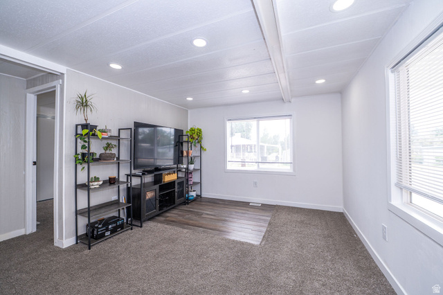 2600 North Hill Field Road, Unit 5 Layton, UT 84041 - Photo 6 of 33 Bright interior space featuring recessed lighting, a combination of carpet and wood-finish flooring, and multiple windows with blinds
