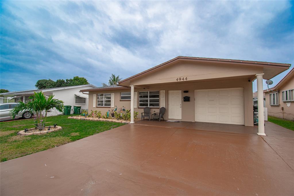 4944 Northwest 55th Street Tamarac, FL 33319 - Photo 9 of 51 Oversized driveway fits up to 6 cars