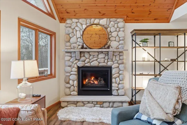 a dining room with furniture a chandelier and wooden floor