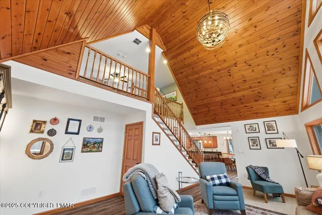 a kitchen with stainless steel appliances granite countertop a refrigerator a sink a stove and island