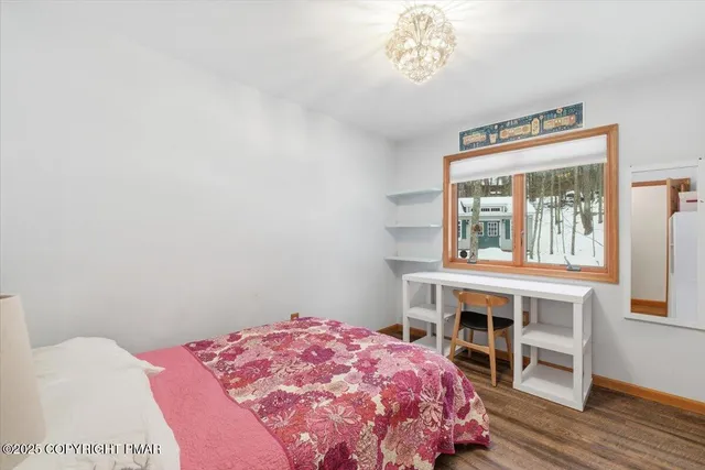 a view of a house with a snow in the yard