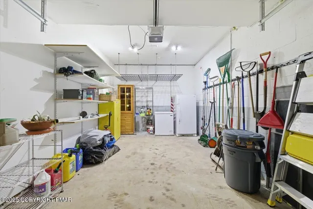 a front view of a house with a tree