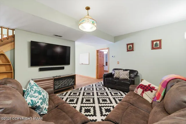 a bathroom with a toilet sink shower and mirror