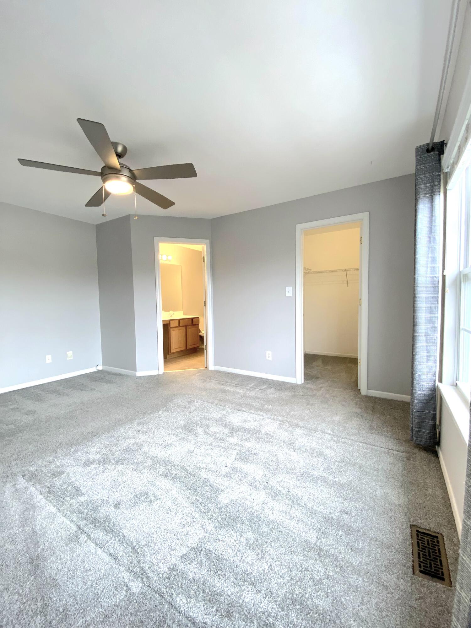 11664 Broadway Crown Point, IN 46307 - Photo 14 of 19 a view of a livingroom with a ceiling fan and window
