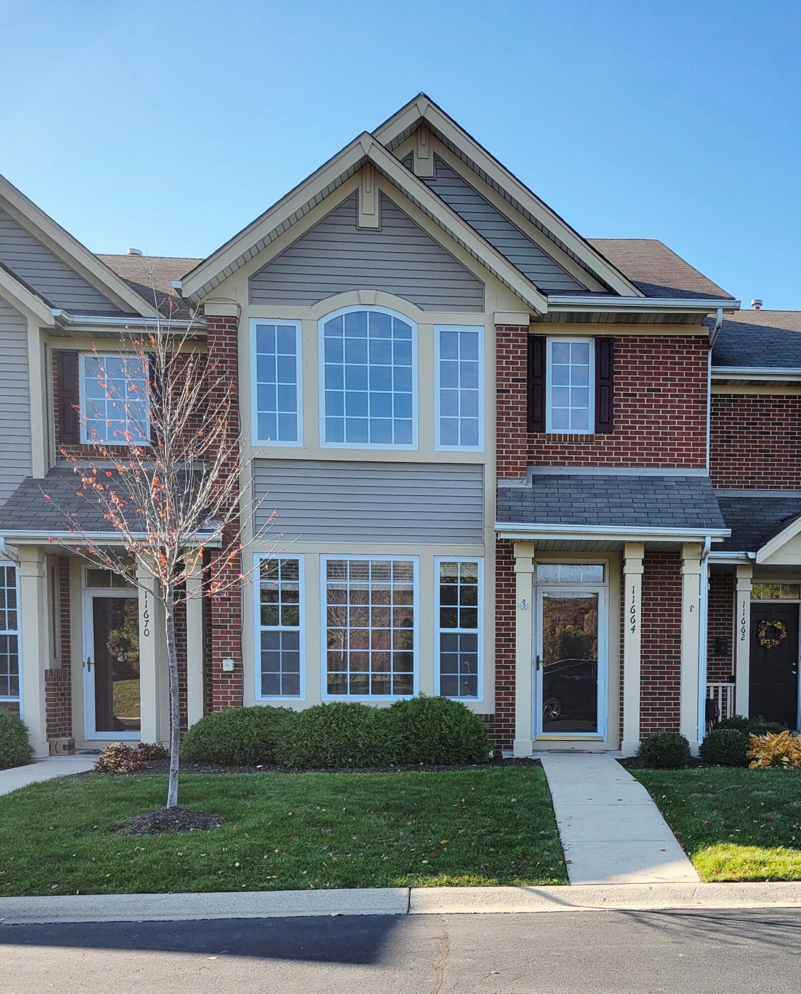 11664 Broadway Crown Point, IN 46307 - Photo 2 of 19 a front view of a house with garden