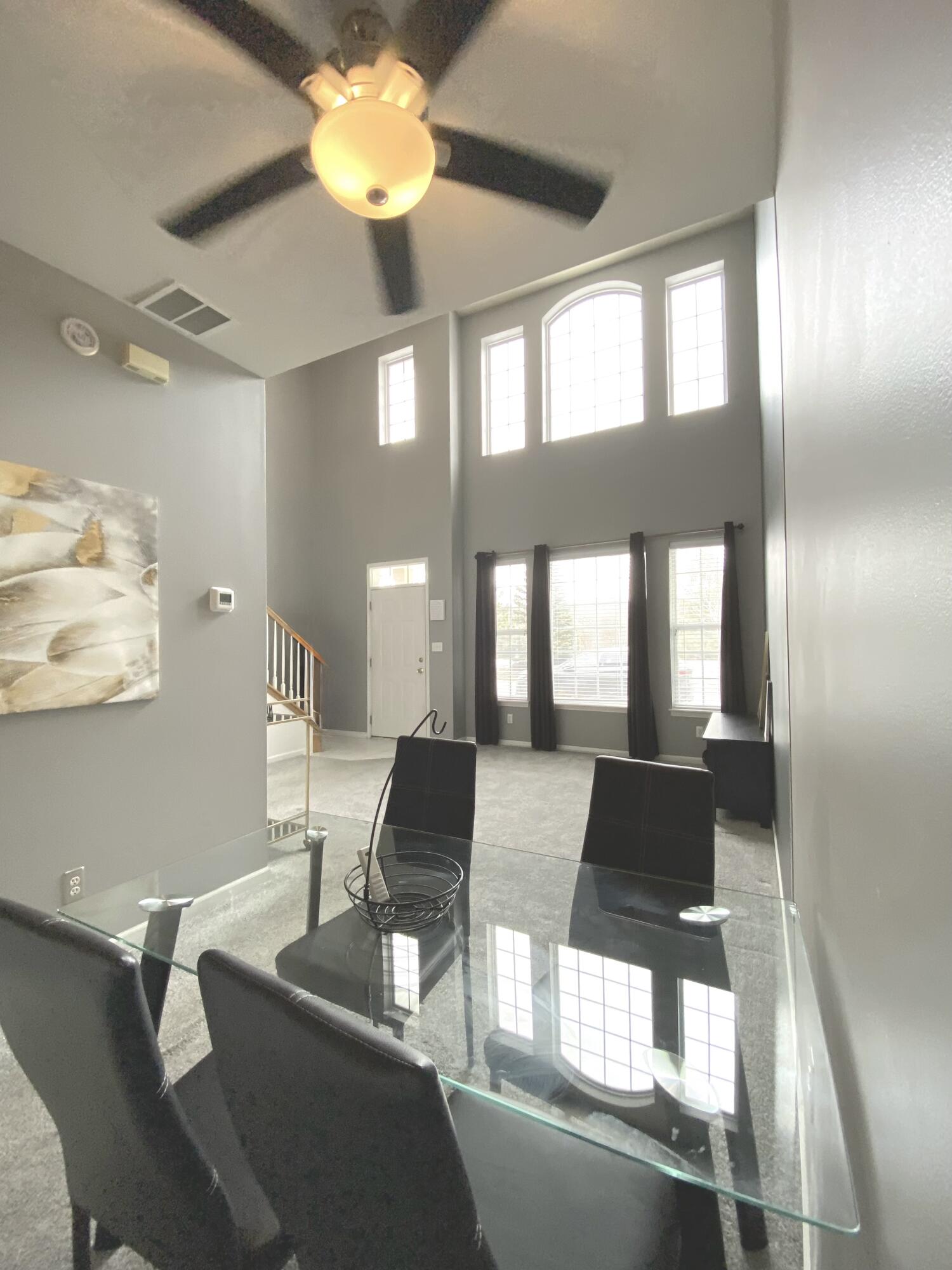 11664 Broadway Crown Point, IN 46307 - Photo 5 of 19 a view of a dining room with furniture and a large window