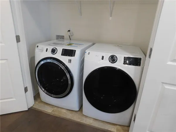 a utility room with dryer and washer