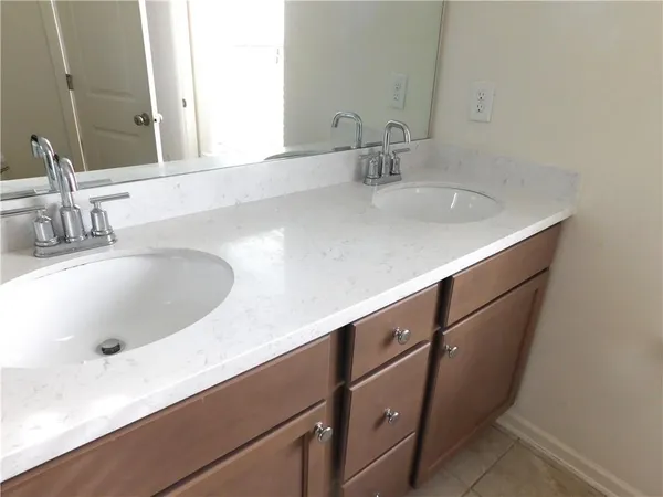 a close view of a sink and a mirror