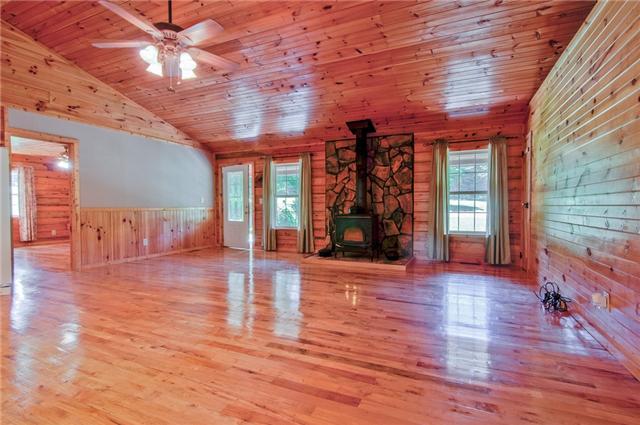 2446 Tower Road Nunnelly, TN 37137 - Photo 2 of 20 Very open space with the rich wood flooring, walls and ceiling.