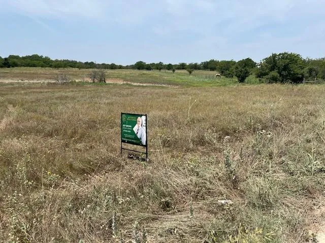 a view of a lake with mountain in the background
