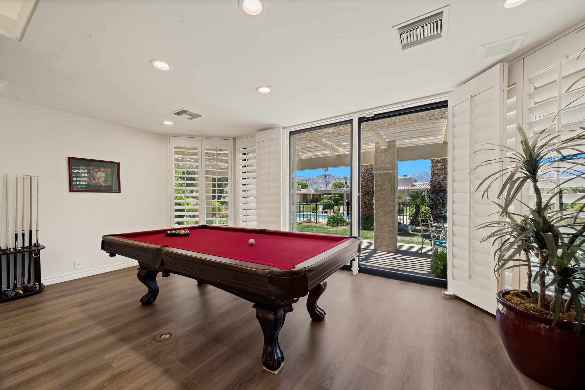 5 Stanford Drive Rancho Mirage, CA 92270 - Photo 13 of 53 a room with furniture and wooden floor