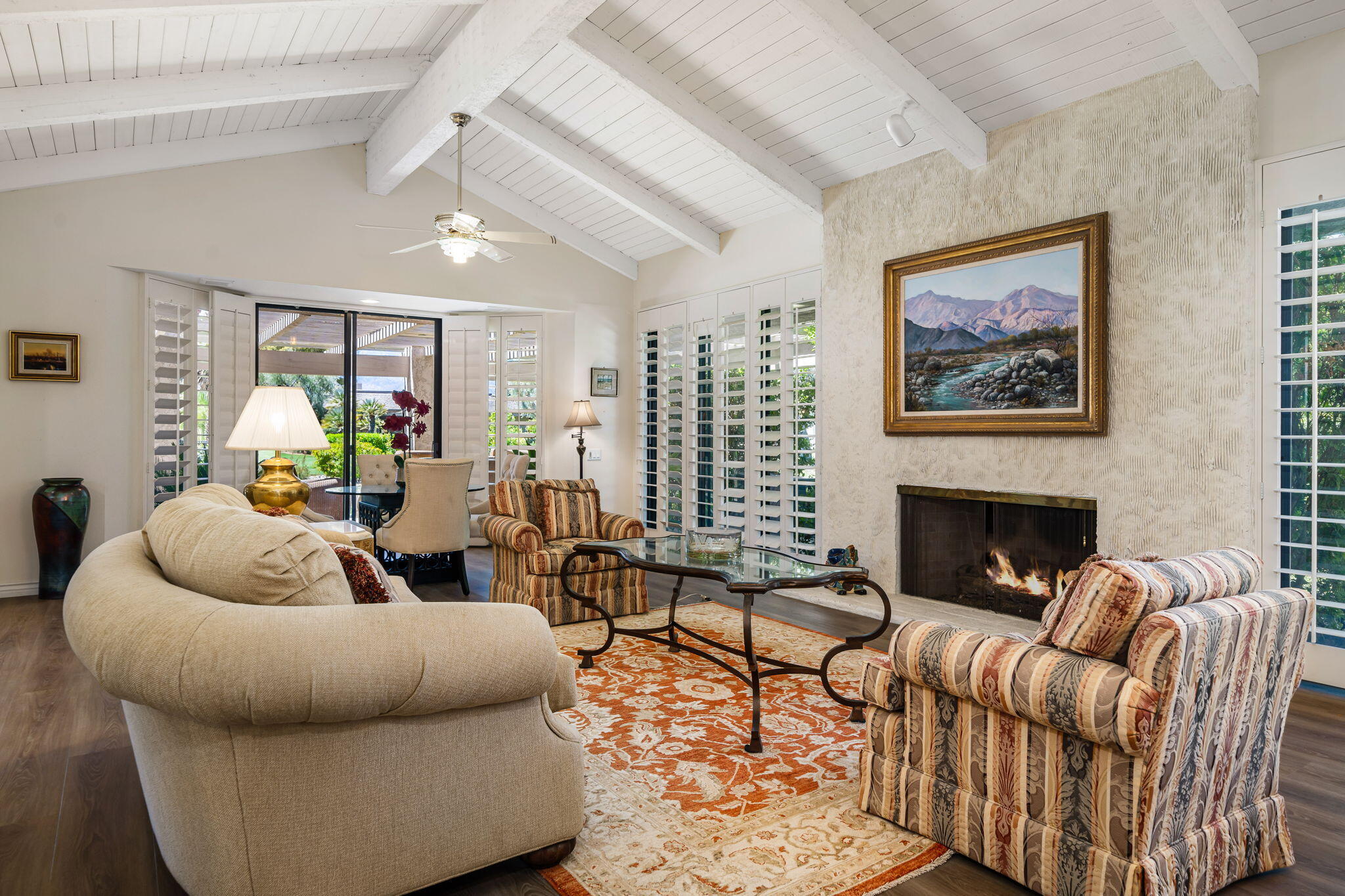 5 Stanford Drive Rancho Mirage, CA 92270 - Photo 18 of 53 a living room with furniture flower pot and a fireplace