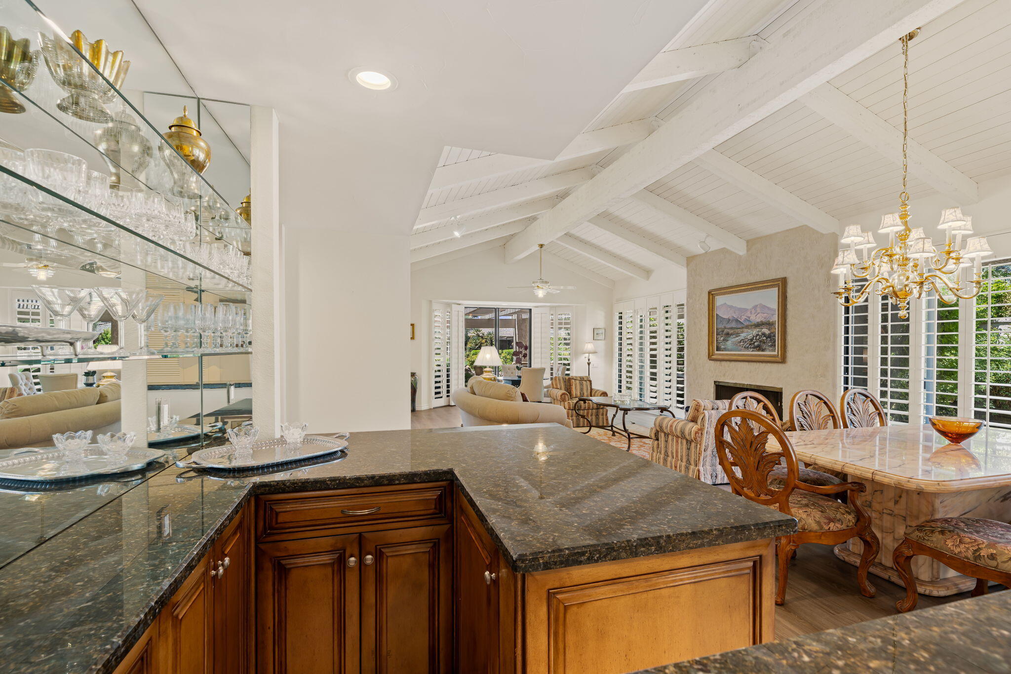 5 Stanford Drive Rancho Mirage, CA 92270 - Photo 22 of 53 a kitchen with counter top space and living room