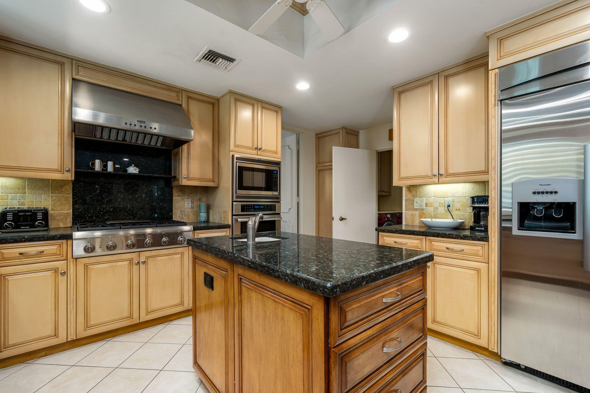 5 Stanford Drive Rancho Mirage, CA 92270 - Photo 26 of 53 a kitchen with stainless steel appliances granite countertop a sink stove and refrigerator