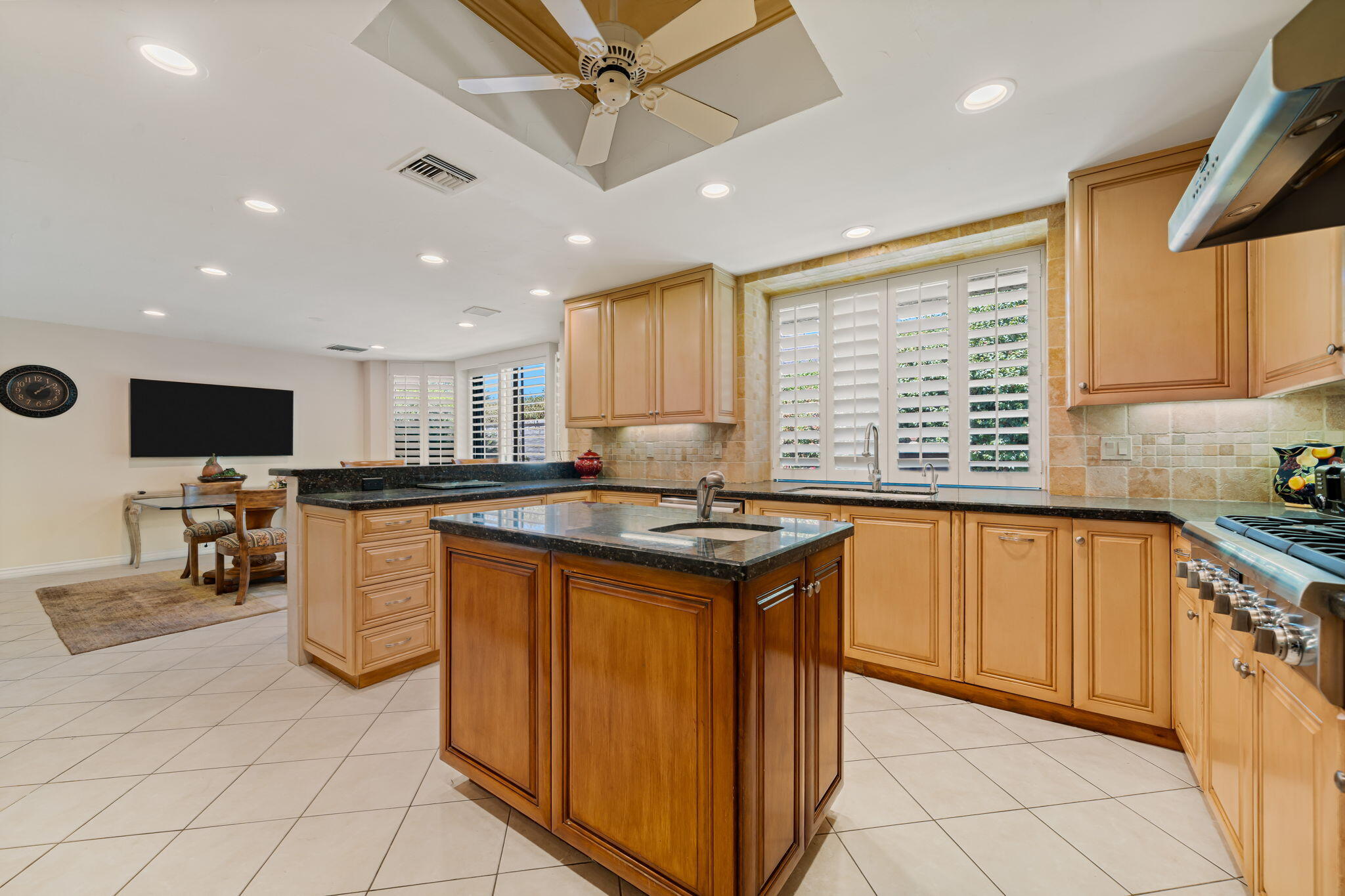 5 Stanford Drive Rancho Mirage, CA 92270 - Photo 28 of 53 a kitchen with stainless steel appliances granite countertop a sink counter space cabinets and a window