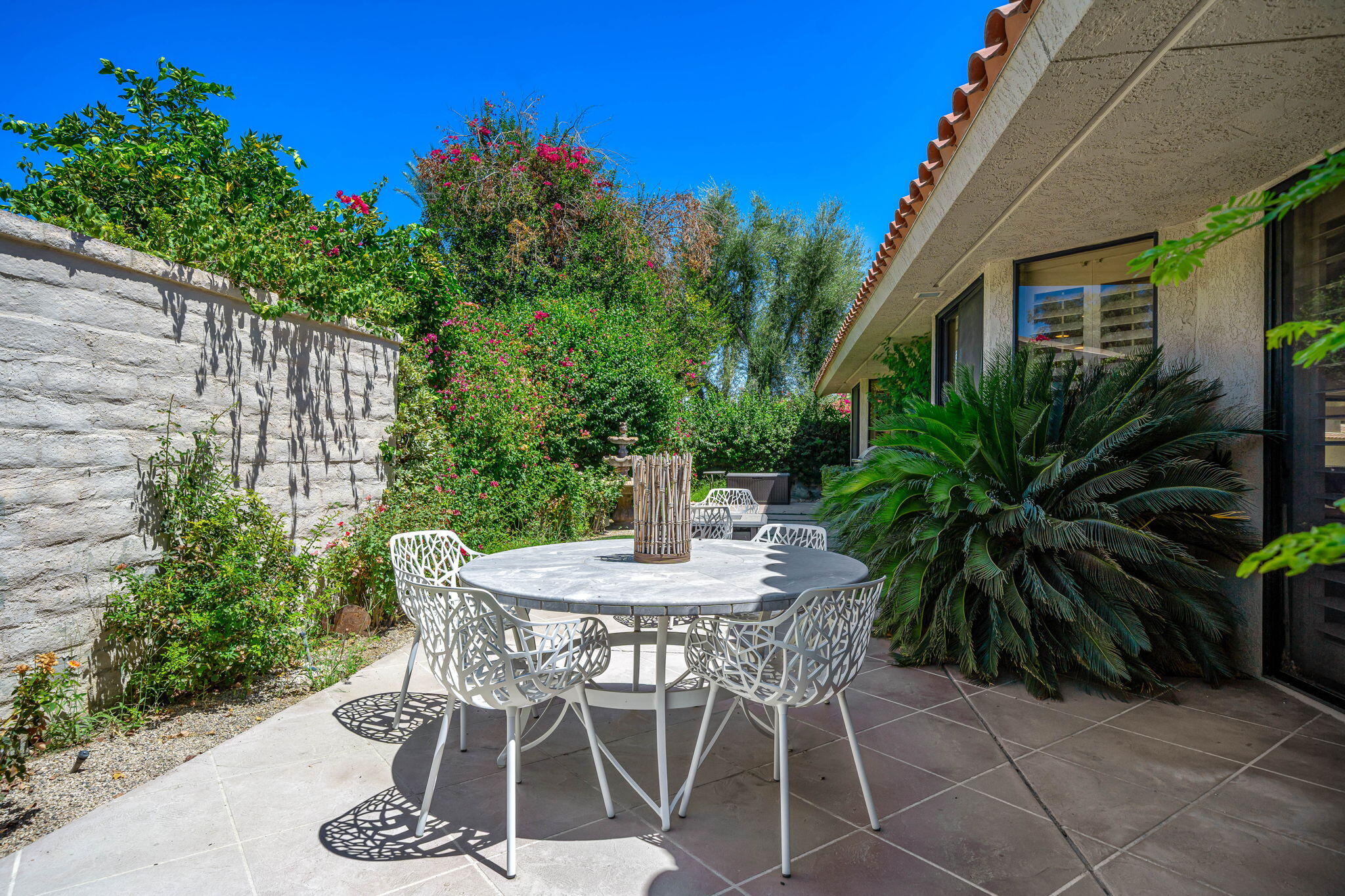5 Stanford Drive Rancho Mirage, CA 92270 - Photo 29 of 53 a view of an outdoor space with table and chair