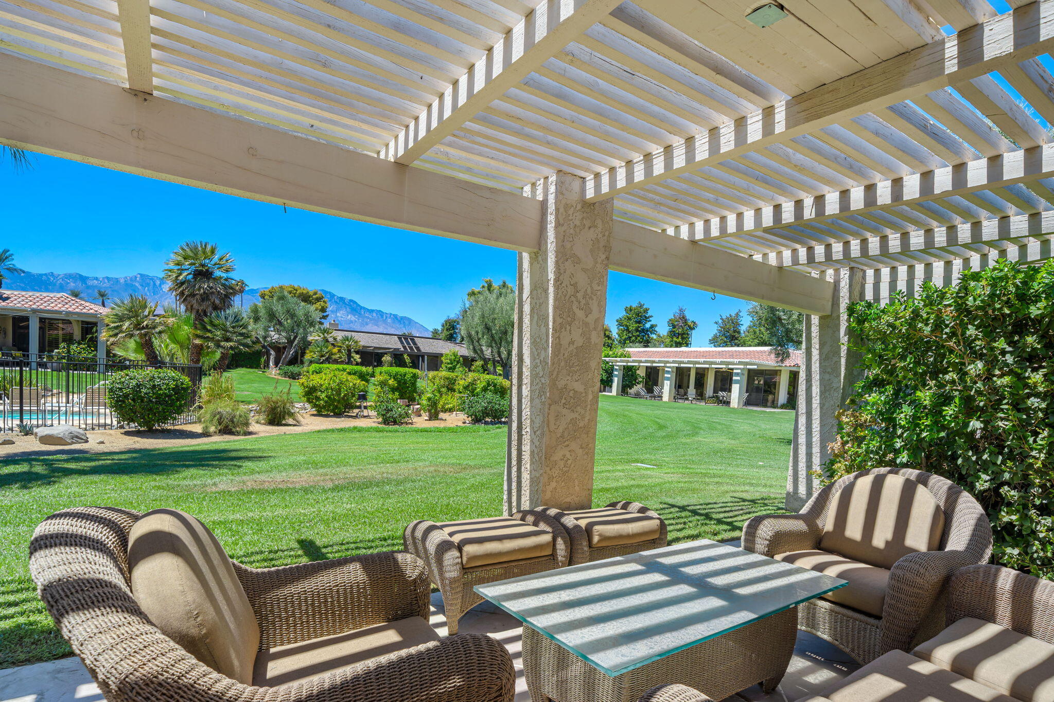 5 Stanford Drive Rancho Mirage, CA 92270 - Photo 35 of 53 a view of a patio with couches table and chairs