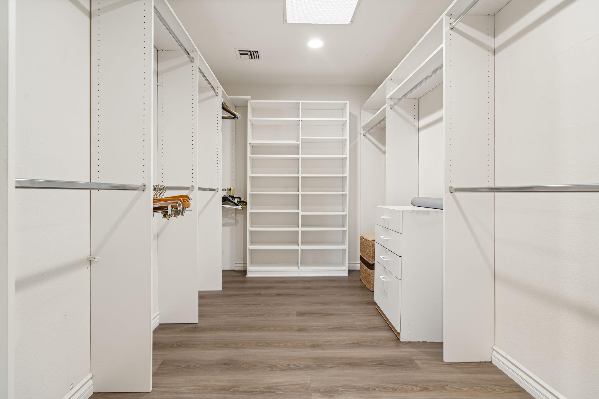 5 Stanford Drive Rancho Mirage, CA 92270 - Photo 45 of 53 a view of walk in closet with wooden floor and entryway