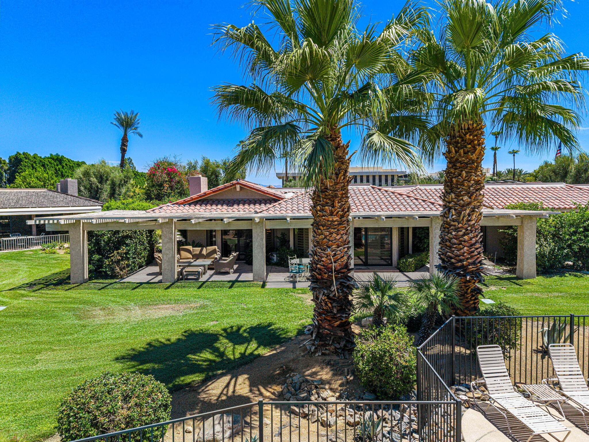 5 Stanford Drive Rancho Mirage, CA 92270 - Photo 5 of 53 a front view of a house with garden