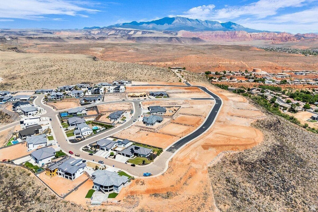 Undisclosed Address St. George, UT 84770 - Photo 6 of 11 Aerial perspective showcasing a developing residential community with paved roadways
