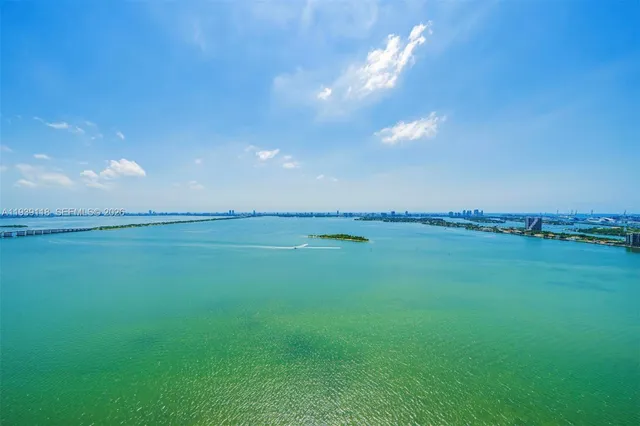 a view of an ocean and a yard